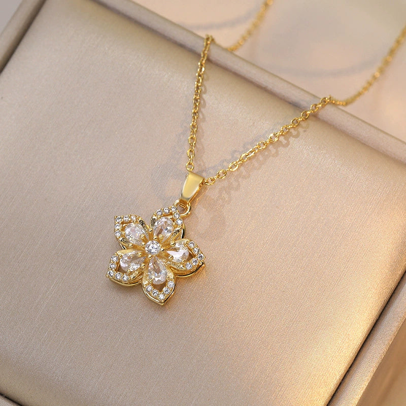 Women's floral fidget spinner necklace with rotating crystal flower pendant