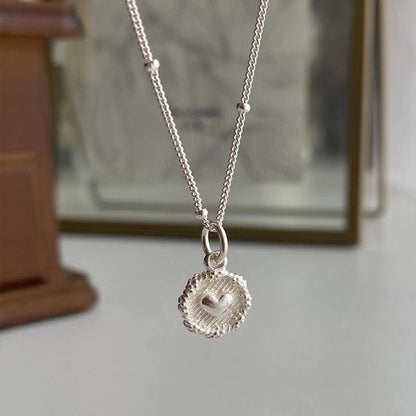 Small round heart pendant necklace